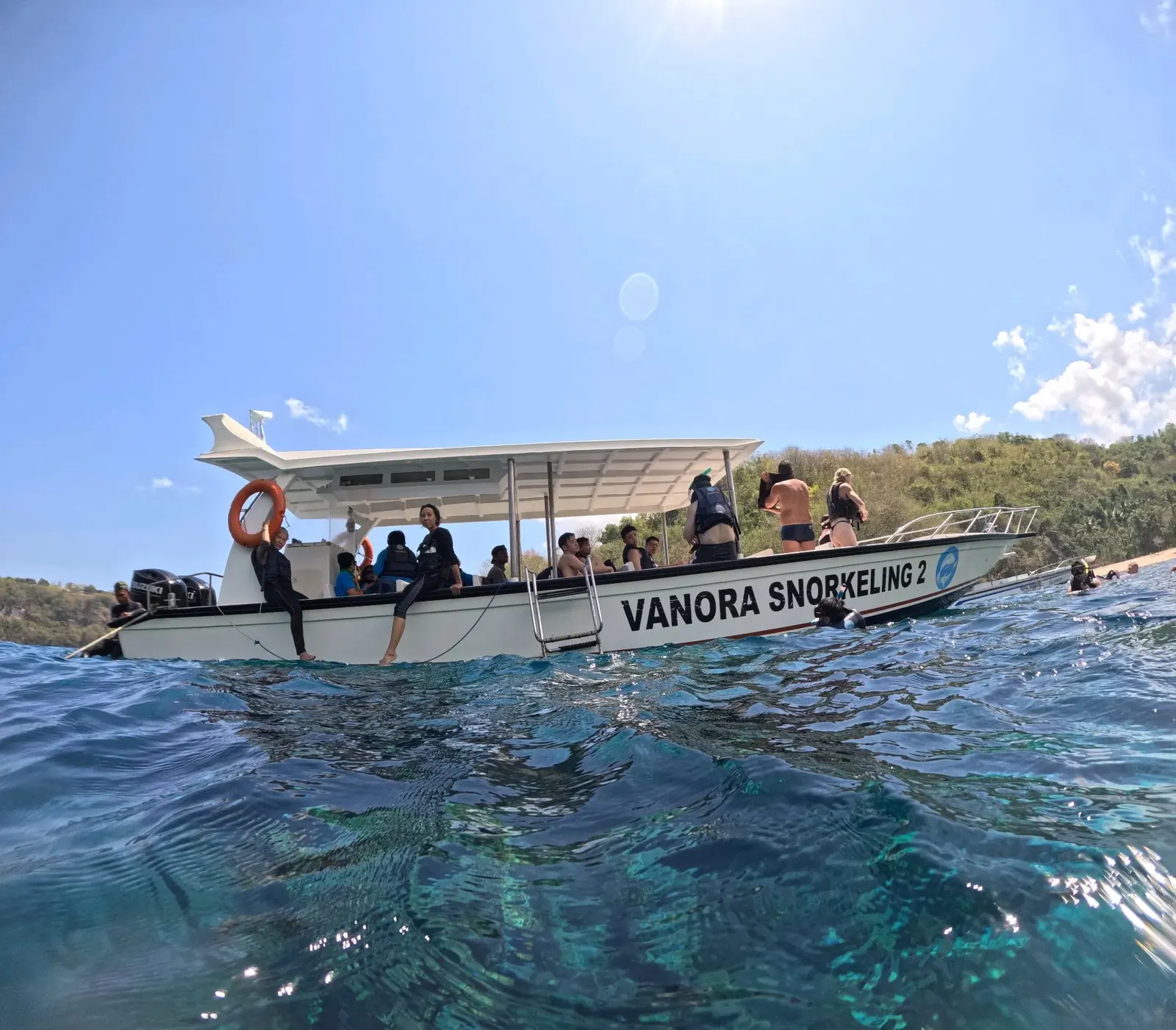 Snorkeling boat on the clear waters of Nusa Penida